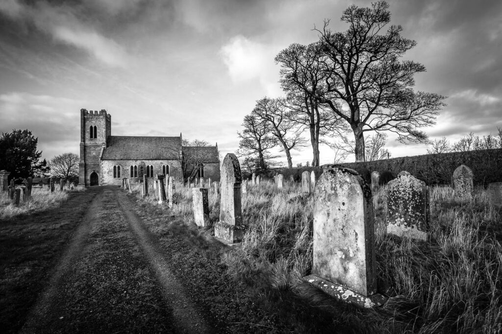 Time's Arrow. Image of churchyard and gravestones as metaphor for time